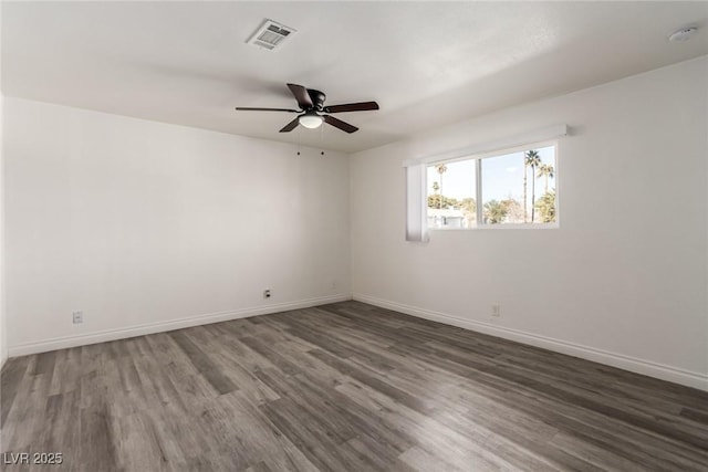 unfurnished room featuring dark hardwood / wood-style floors and ceiling fan