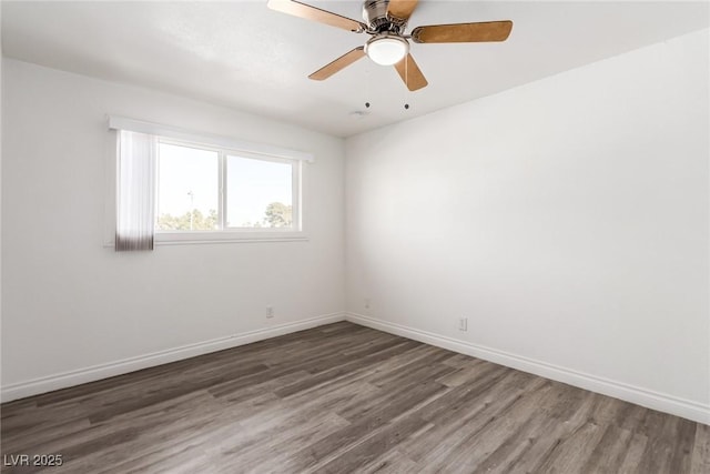 unfurnished room featuring dark hardwood / wood-style flooring and ceiling fan