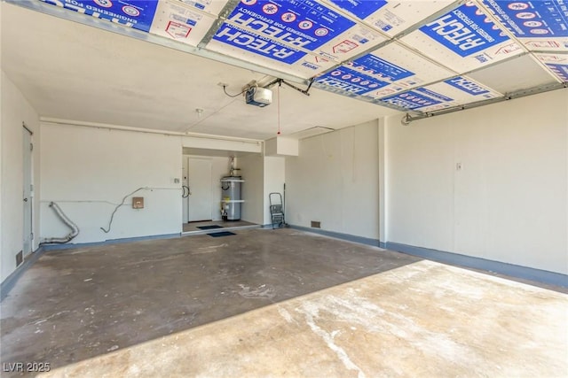 garage with a garage door opener and water heater