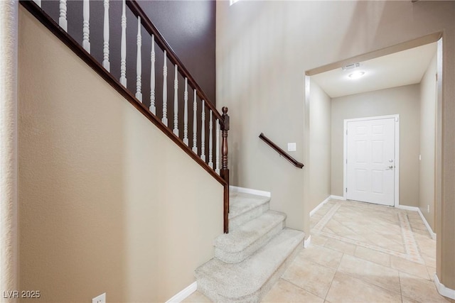 foyer with light tile patterned floors