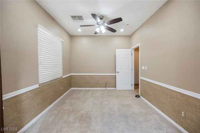 carpeted empty room with ceiling fan