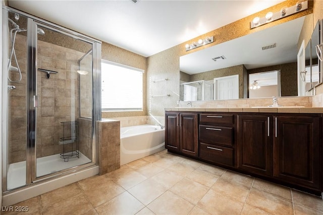 bathroom with vanity, plus walk in shower, and tile patterned flooring