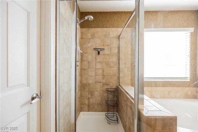 bathroom featuring shower with separate bathtub