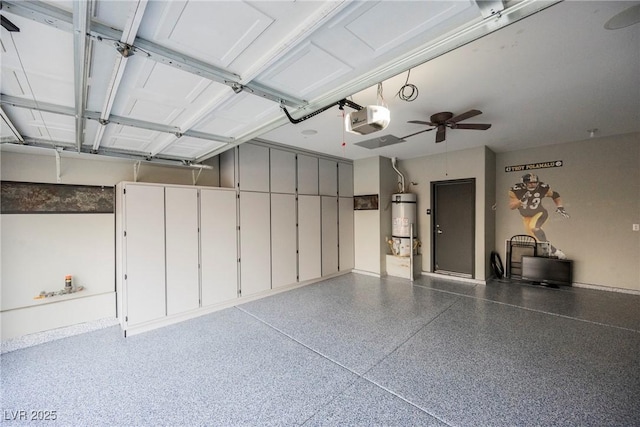 garage featuring a garage door opener and water heater