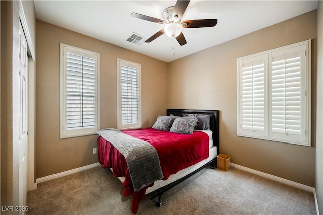 carpeted bedroom with ceiling fan