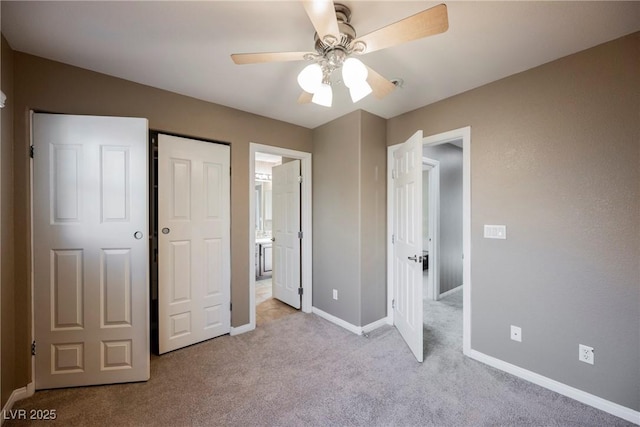 unfurnished bedroom featuring ceiling fan and light carpet