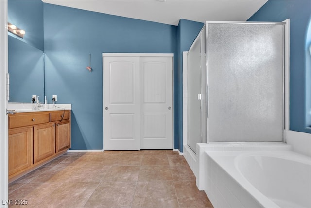 bathroom with vanity, tile patterned floors, and independent shower and bath