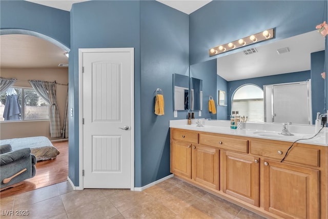 bathroom with vanity and tile patterned flooring