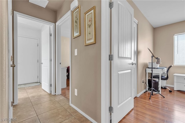 hallway with light tile patterned floors