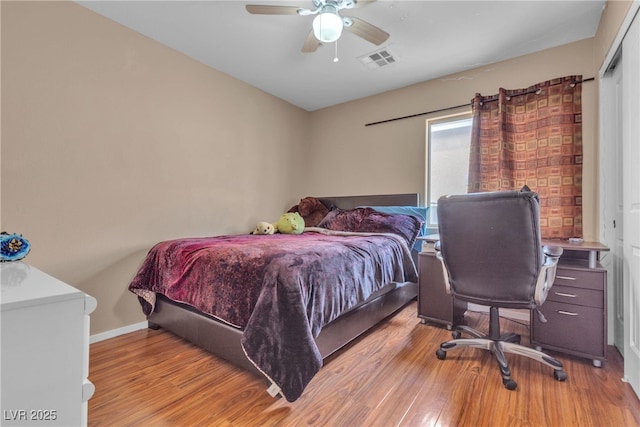 bedroom with ceiling fan and light wood-type flooring