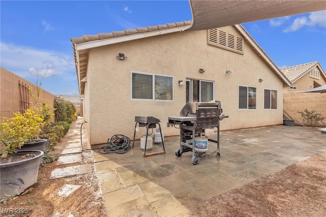 rear view of property featuring a patio