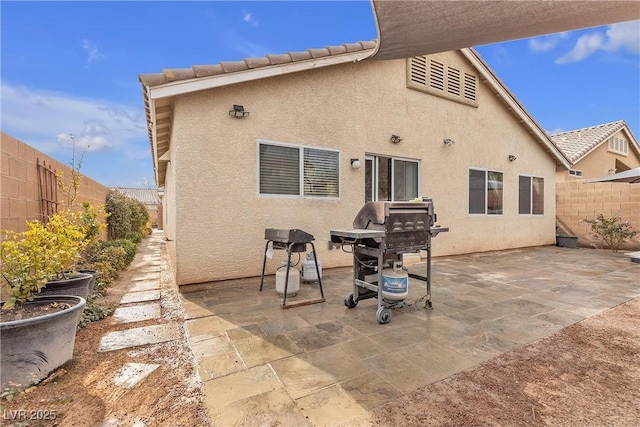 rear view of property with a patio area