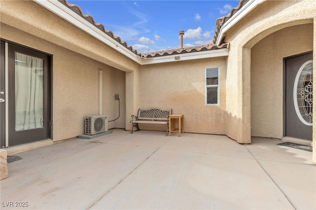 view of patio / terrace featuring ac unit