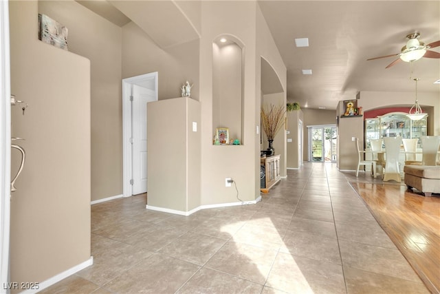 corridor featuring light tile patterned floors