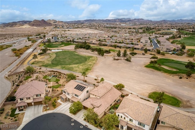 aerial view with a residential view, view of golf course, and a mountain view