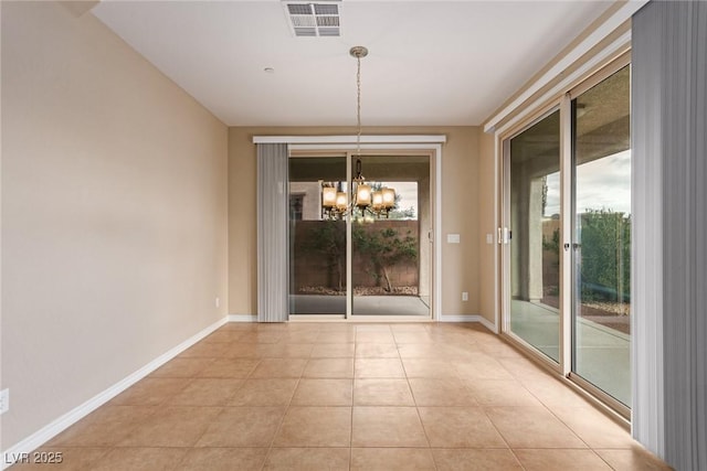 unfurnished dining area featuring baseboards, visible vents, a notable chandelier, and light tile patterned flooring