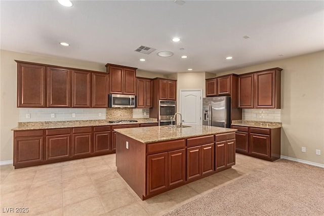 kitchen featuring visible vents, stainless steel appliances, a sink, and recessed lighting