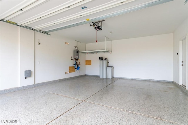 garage featuring a garage door opener, water heater, and baseboards