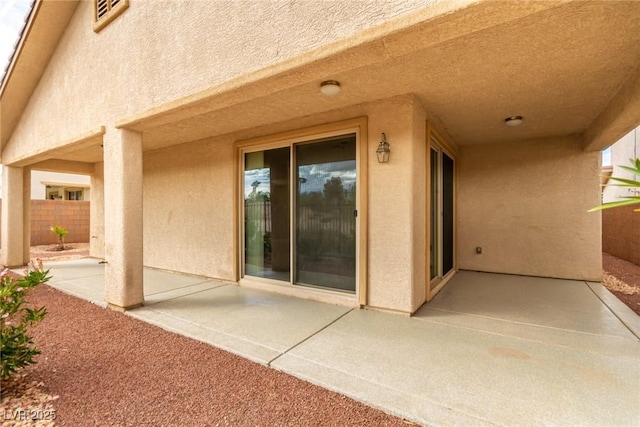 view of patio / terrace featuring fence