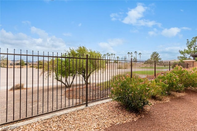 view of gate with fence