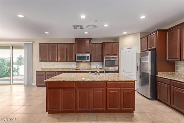 kitchen with tasteful backsplash, visible vents, stainless steel appliances, a sink, and recessed lighting