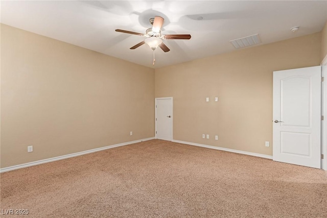 empty room with ceiling fan, carpet, visible vents, and baseboards