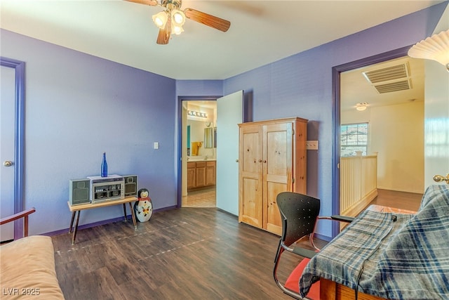 office area with ceiling fan and dark hardwood / wood-style flooring