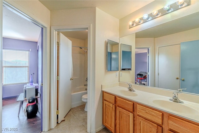 full bathroom with tile patterned flooring, vanity, shower / bathtub combination, and toilet