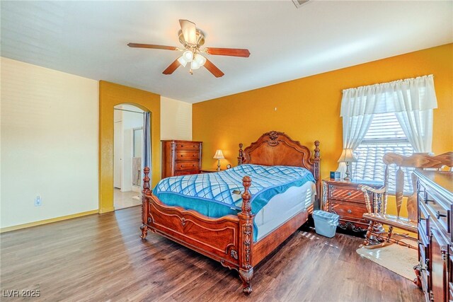 bedroom with ceiling fan and hardwood / wood-style floors