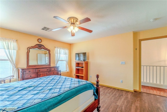 bedroom featuring hardwood / wood-style floors and ceiling fan