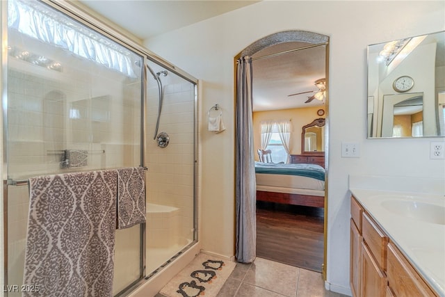 bathroom featuring vanity, tile patterned floors, ceiling fan, and a shower with shower door