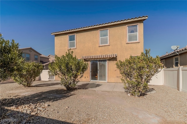 back of property with a patio area