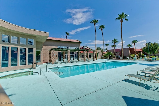 view of swimming pool featuring a patio