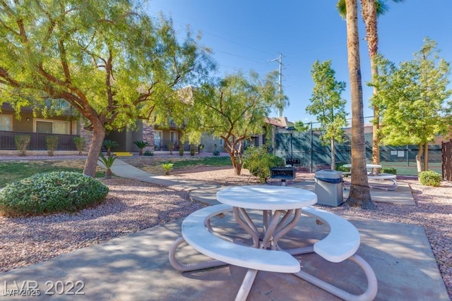 surrounding community with a patio area