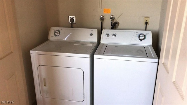 washroom with washing machine and clothes dryer