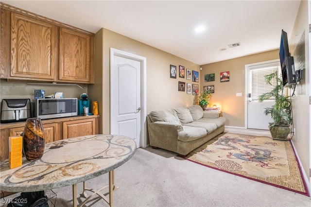 living room featuring light colored carpet