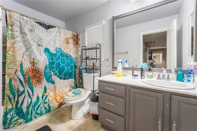 bathroom featuring vanity, walk in shower, tile patterned floors, and toilet