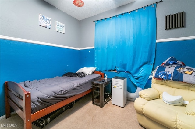 carpeted bedroom with a textured ceiling