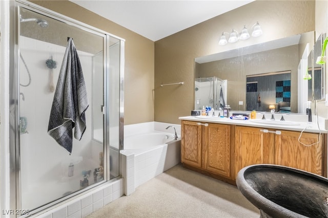 bathroom featuring vanity and independent shower and bath