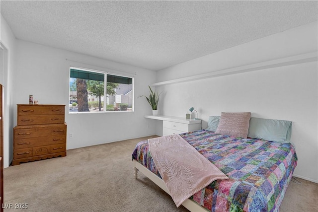 carpeted bedroom featuring a textured ceiling