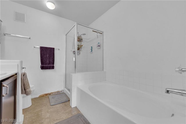 full bathroom with independent shower and bath, vanity, tile patterned floors, and toilet