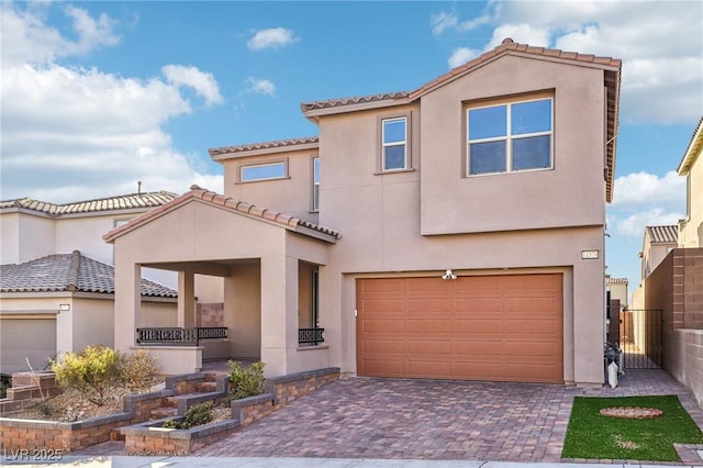 mediterranean / spanish-style house featuring a garage