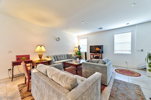 tiled living room featuring plenty of natural light