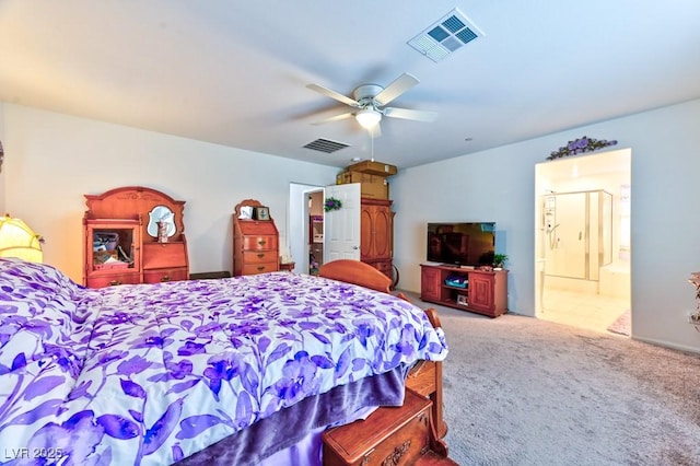 carpeted bedroom featuring ensuite bath and ceiling fan