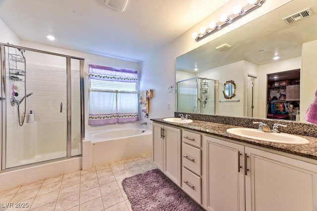 bathroom with vanity, tile patterned floors, and separate shower and tub