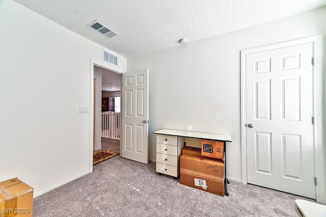 bedroom featuring light carpet