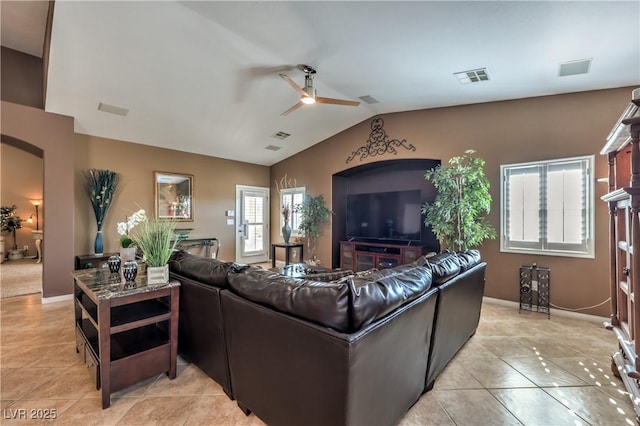 tiled living room with lofted ceiling and ceiling fan