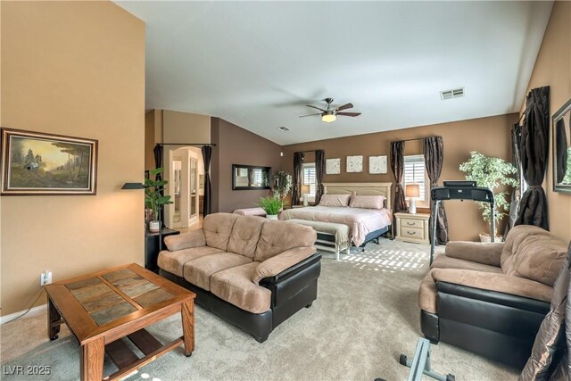 carpeted bedroom featuring ceiling fan and lofted ceiling