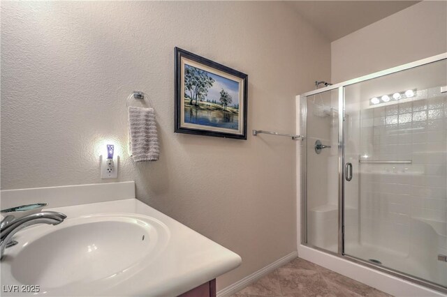 bathroom with vanity and walk in shower