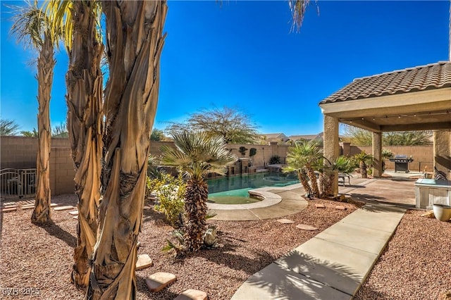 view of yard with a fenced in pool and a patio area